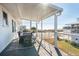 Relaxing porch with water views, outdoor seating and an outdoor rug creating a cozy atmosphere at 405 Palmetto Blvd, Edisto Island, SC 29438