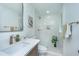 Modern bathroom featuring a marble shower, quartz countertops, and bronze fixtures at 4233 Oakridge Dr, North Charleston, SC 29418