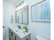 Modern bathroom features black fixtures, a large mirror, and a wooden vanity at 4233 Oakridge Dr, North Charleston, SC 29418