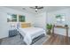 Cozy bedroom with natural light, a ceiling fan, and light colored walls at 4233 Oakridge Dr, North Charleston, SC 29418