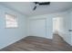 Well-lit bedroom features a ceiling fan, closet with folding doors, and wood-look flooring at 4233 Oakridge Dr, North Charleston, SC 29418