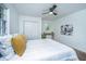 Comfortable bedroom with ample lighting, soft bedding, and a ceiling fan at 4233 Oakridge Dr, North Charleston, SC 29418