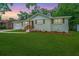 Charming single-story home features a well-manicured lawn and inviting front porch at 4233 Oakridge Dr, North Charleston, SC 29418