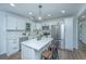 Beautiful kitchen with white cabinets, stainless steel appliances and island with seating at 4233 Oakridge Dr, North Charleston, SC 29418