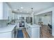 Modern kitchen with white cabinets, stainless steel appliances, and a large island at 4233 Oakridge Dr, North Charleston, SC 29418