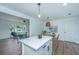 Bright kitchen with white cabinets, stainless appliances, island and open to the living room at 4233 Oakridge Dr, North Charleston, SC 29418