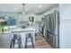 Charming kitchen with white cabinets, stainless appliances, and a sliding glass door at 4233 Oakridge Dr, North Charleston, SC 29418