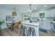 Stylish kitchen with white cabinets, stainless steel appliances and a cozy breakfast nook at 4233 Oakridge Dr, North Charleston, SC 29418
