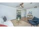 Living room featuring hardwood floors, ceiling fan, and neutral decor with kitchen view at 4233 Oakridge Dr, North Charleston, SC 29418