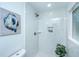 Modern shower with white marble tile, bronze shower head, and built in shelf at 4233 Oakridge Dr, North Charleston, SC 29418