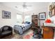 Bright bedroom with ceiling fan, filled with natural light, and decorated with unique furnishings at 4953 W Liberty Park Cir, North Charleston, SC 29405