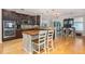 Kitchen with an island, stainless steel appliances, and dark wood cabinets at 4953 W Liberty Park Cir, North Charleston, SC 29405