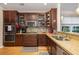 Well-equipped kitchen boasts granite countertops, stainless steel appliances, and ample cabinet space at 4953 W Liberty Park Cir, North Charleston, SC 29405