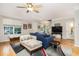 Light-filled living room with hardwood floors, comfortable seating, and stylish accents at 4953 W Liberty Park Cir, North Charleston, SC 29405