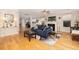 Spacious living room with hardwood floors, stylish decor, and a cozy fireplace at 4953 W Liberty Park Cir, North Charleston, SC 29405