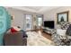 Bright living room with balcony, modern decor, and ample natural light at 4953 W Liberty Park Cir, North Charleston, SC 29405