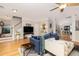 Open living area boasts hardwood floors, ample seating, and access to the dining area at 4953 W Liberty Park Cir, North Charleston, SC 29405