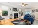 Inviting living room featuring a fireplace, hardwood floors, and comfortable seating at 4953 W Liberty Park Cir, North Charleston, SC 29405