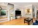 Inviting living room featuring hardwood floors and a staircase leading to the upper level at 4953 W Liberty Park Cir, North Charleston, SC 29405