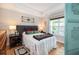 Comfortable main bedroom with a tray ceiling and view of the home's exterior at 4953 W Liberty Park Cir, North Charleston, SC 29405