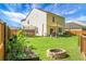 Spacious backyard with a patio, a fire pit, a garden, and a trampoline at 508 Glady Rd, Moncks Corner, SC 29461