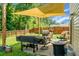 Enjoy outdoor living on this patio with a shade canopy and a lush, green surrounding at 508 Glady Rd, Moncks Corner, SC 29461