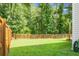 The backyard boasts a well-manicured lawn and a full, wooden privacy fence at 508 Glady Rd, Moncks Corner, SC 29461