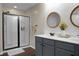 Updated bathroom boasts double vanity sinks, modern fixtures, and a tiled shower at 508 Glady Rd, Moncks Corner, SC 29461