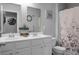 Bathroom featuring a double vanity, neutral walls, framed mirror, and a shower-tub combination at 508 Glady Rd, Moncks Corner, SC 29461