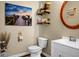 Cozy half bath features a white vanity, decorative mirror, and charming decor at 508 Glady Rd, Moncks Corner, SC 29461