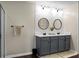 Stylish bathroom features a double vanity with round mirrors and modern lighting at 508 Glady Rd, Moncks Corner, SC 29461