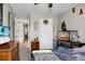 Bedroom with neutral walls, ceiling fan, dark wooden dresser, with a view into the hallway at 508 Glady Rd, Moncks Corner, SC 29461