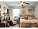 Cozy bedroom with a ceiling fan, a metal bed frame, and a makeup vanity area at 508 Glady Rd, Moncks Corner, SC 29461