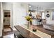 Charming dining area with a farmhouse table and bench seating, open to the modern kitchen at 508 Glady Rd, Moncks Corner, SC 29461