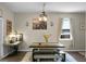Bright dining room featuring a farmhouse table, bench seating, and view of vintage sewing table at 508 Glady Rd, Moncks Corner, SC 29461