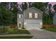 Charming two-story home with a well-manicured lawn and a two-car garage, situated beneath a captivating dusk sky at 508 Glady Rd, Moncks Corner, SC 29461