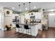 Modern kitchen with white cabinets, granite countertops, and a stylish island with seating for casual dining at 508 Glady Rd, Moncks Corner, SC 29461