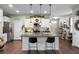 Modern kitchen featuring white cabinets, stainless steel appliances, and a stylish island for casual dining at 508 Glady Rd, Moncks Corner, SC 29461