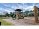 Community playground featuring a tower with a slide and climbing wall, perfect for Gathering fun and outdoor activities at 508 Glady Rd, Moncks Corner, SC 29461