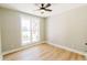 Bright and airy bedroom with hardwood floors, large window, and neutral walls at 54 Summer Dr, Walterboro, SC 29488