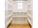 Pantry with white shelves and wood floors at 54 Summer Dr, Walterboro, SC 29488