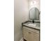 Stylish powder room with granite countertops, modern vanity, and arched mirror at 54 Summer Dr, Walterboro, SC 29488