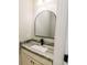 Stylish powder room with granite countertops, modern vanity, and arched mirror at 54 Summer Dr, Walterboro, SC 29488