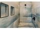 Close-up of modern shower design featuring a built-in niche and rainfall showerhead at 54 Summer Dr, Walterboro, SC 29488