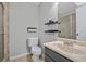 Neutral tiled bathroom featuring toilet, shelves, modern fixtures and glass enclosed shower at 58 Indigo Ln, Goose Creek, SC 29445