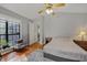 Comfortable bedroom featuring hardwood floors, natural light, and a ceiling fan at 58 Indigo Ln, Goose Creek, SC 29445