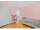 Bedroom with light pink walls, wood floors and closet at 58 Indigo Ln, Goose Creek, SC 29445
