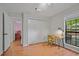 Bedroom featuring hardwood floors, a large window, and a bright desk area at 58 Indigo Ln, Goose Creek, SC 29445