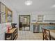 Eat-in kitchen featuring white cabinets, stainless steel appliances, granite countertops and light blue lower cabinets at 58 Indigo Ln, Goose Creek, SC 29445