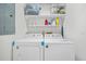 Laundry room featuring white washer and dryer with white shelving and storage at 58 Indigo Ln, Goose Creek, SC 29445